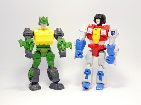 Two transformers. Transformers cars and plane. Cars that transform into robots. Transforms movie. Toy cars for children. Autobot. Machines. Colorful.