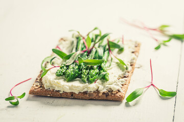 Healthy and tasty sandwich with creamy cheese and asparagus