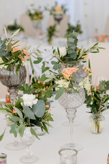 Fototapeta na wymiar Wedding flower arrangement on table