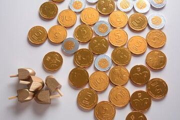 Hanukkah Chocolate shekel Coins. Delicious chocolate shekels in golden package. Hanukkah gelt with menorah.
