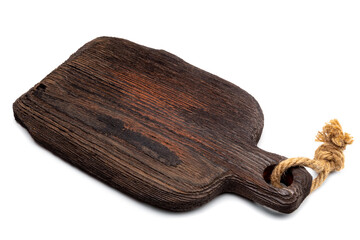 Empty chopping board with a hemp rope loop on the handle. Old Wooden Cutting Board with structure and crackes, scratched, black or brown. Workpiece or blank for a culinary-themed design