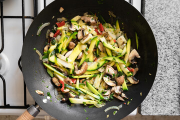 Top view vegan vegetable wok. Healthy food concept.