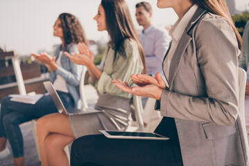 Cropped profile side photo of people colleagues having meeting team building clapping applaud outdoors outside