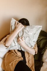 Woman holding a pillow, quarantine stay home concept