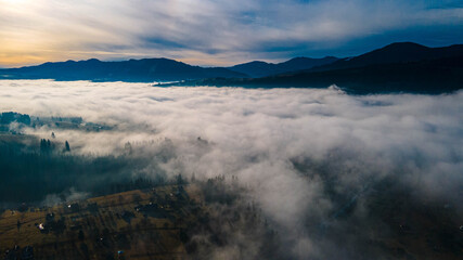 mountains tops high above clouds fog