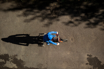 child cycling on road top view