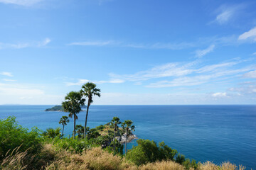 Fototapeta premium Tourists at Phromthep cape viewpoint at the south of Phuket Island, Thailand. Tropical paradise in Thailand. Phuket is a popular destination famous for tourists