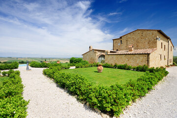 Idyllic view, typical Tuscany farmhouse among fields