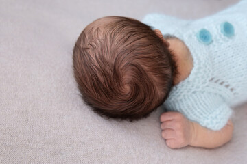 crown. head of the newborn baby first hear, close up, macro shot. newborn hair.