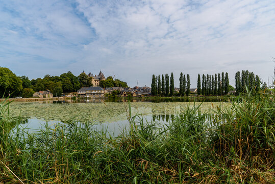 View of the medieval town of Comburg from the lake with the Castle on background, French Brittany