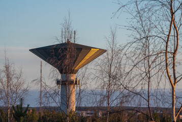 water tower for a city taken on a hill from the side