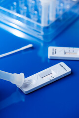 placing sample into a covid-19 rapid antigen test