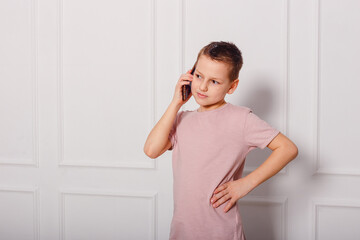 a nine-year-old boy talking on the phone