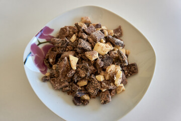 plate full of white and black chocolate pieces