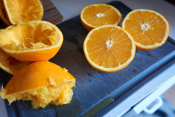 fresh and squeezed oranges on a board