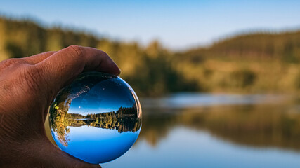 Fototapeta premium Crystal ball landscape shot at Regen, Bavarian forest, Bavaria, Germany