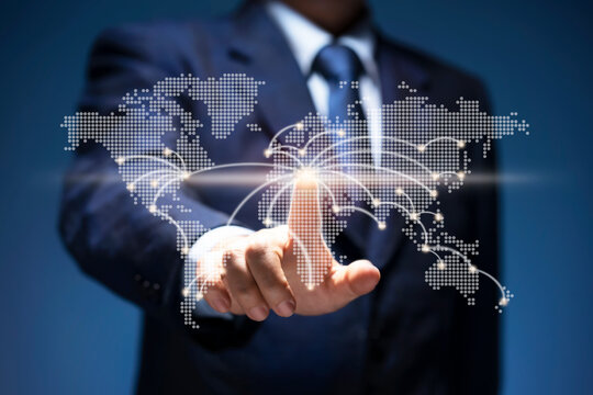 Businessman touch point of city connection line in world map. Man press button on virtual screen of planet earth show start up, business plan, communicate, technology, global network, internet concept - Powered by Adobe