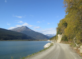a road along a lake in Skagway, Alaska, USA, September
