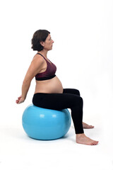 Fototapeta na wymiar pregnant woman exercising with a ball on white background