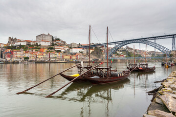 Fototapeta na wymiar Oporto, Europe. Postcard from the picturesque city of Porto, amazing travel destination in Portugal. View to the historic center of the city, Douro River with its beautiful bridge and old monuments.