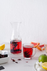 Morning herbal tea.Healthy citrus tea and fresh fruits on the white table