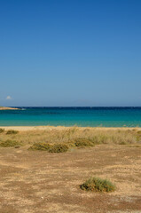 Sand and turquoise sea water in the summer