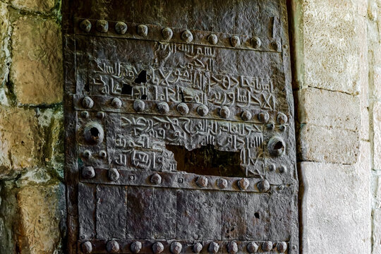 Georgia, Gelati Monastery, details of an old door with arabic inscription in the city of Kutaissi.