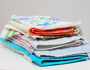 There are colorful towels on the table . Concept - household chores.