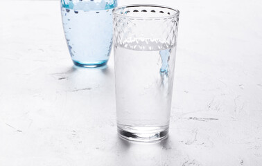 Two drinking glasses with water. Interplay of shadow and light
