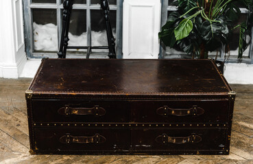 designer apartment interior shelf cabinet with souvenirs bottles figurines bar mirror table chair glass glasses.