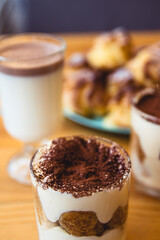 Traditional Italian dessert tiramisu in a glass.