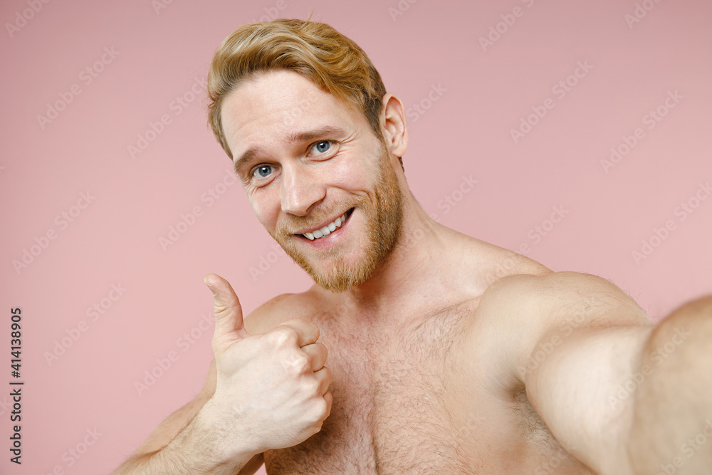 Wall mural close up smiling bearded naked young man 20s perfect skin doing selfie shot on mobile phone showing 