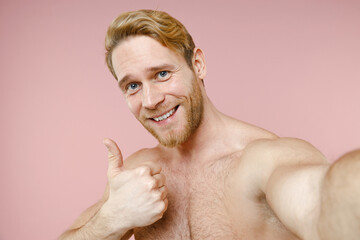 Close up smiling bearded naked young man 20s perfect skin doing selfie shot on mobile phone showing...