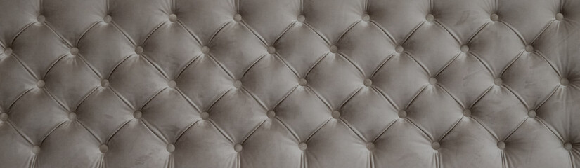 seamless texture of velvety gray fabric on upholstered furniture close-up