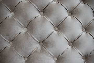 seamless texture of velvety gray fabric on upholstered furniture close-up