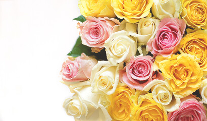 Roses in a bouquet of white, yellow, pink flowers on a light background