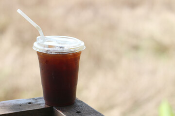 Iced americano coffee with ice on table at cafe.