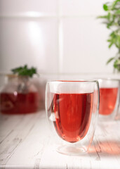 hibiscus tea,rose tea ceremony. Cup of freshly brewed fruit tea, light moody. the bright interior