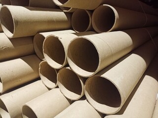 Cardboard sleeves for winding linoleum and carpet.