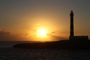 Sunset near a mediterranean lighthouse