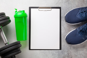 Sneakers and dumbbells. Sport, fitness and healthy lifestyle