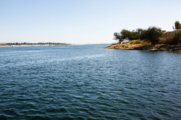Naklejka premium Nile the longest river in Africa. Primary water source of Egypt. Landscape with clear water river.