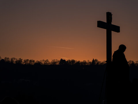 Silhouette of a crucifix at dusk