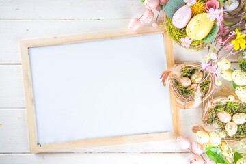 Happy easter background with Nests decoration, colorful eggs and Spring Flowers. Caster card on sunny spring background
