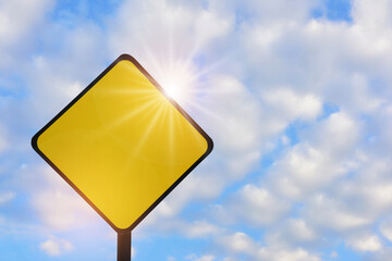 Blank yellow sign on beautiful blue sky with fluffy cloud background. Copy space concept and input text idea