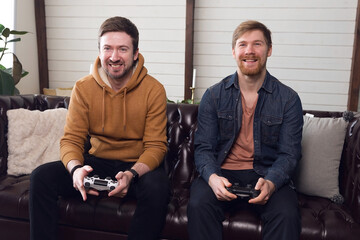 Two guys friend playing game console, games and entertainment at home