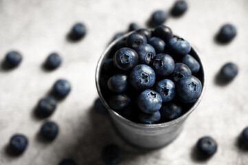 Fresh blueberries in a small metal bucket. Top view. Rustic. Health and vitamins.