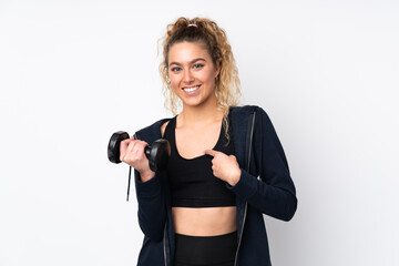 Young sport woman making weightlifting isolated on white background with surprise facial expression