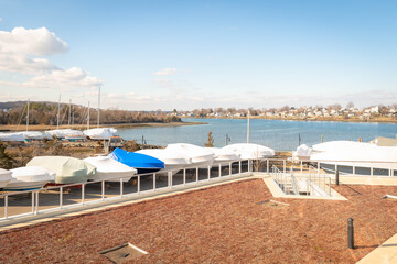 Boats wrapped up along the water in winter
