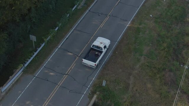 Aerial Overhead of Truck Traveling Alone on Road